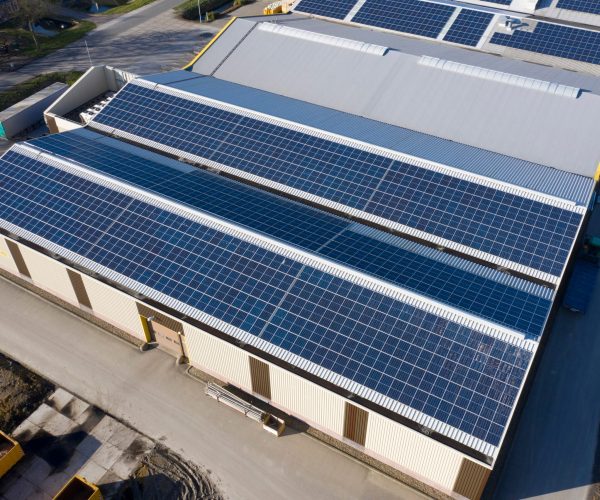 Drone,Photo,Of,Modern,Solar,Panels,On,A,Commercial,Building.